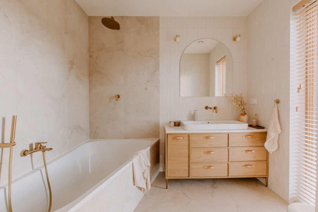 Elegant bathroom with white marble walls and wooden furniture, perfect minimalistic design