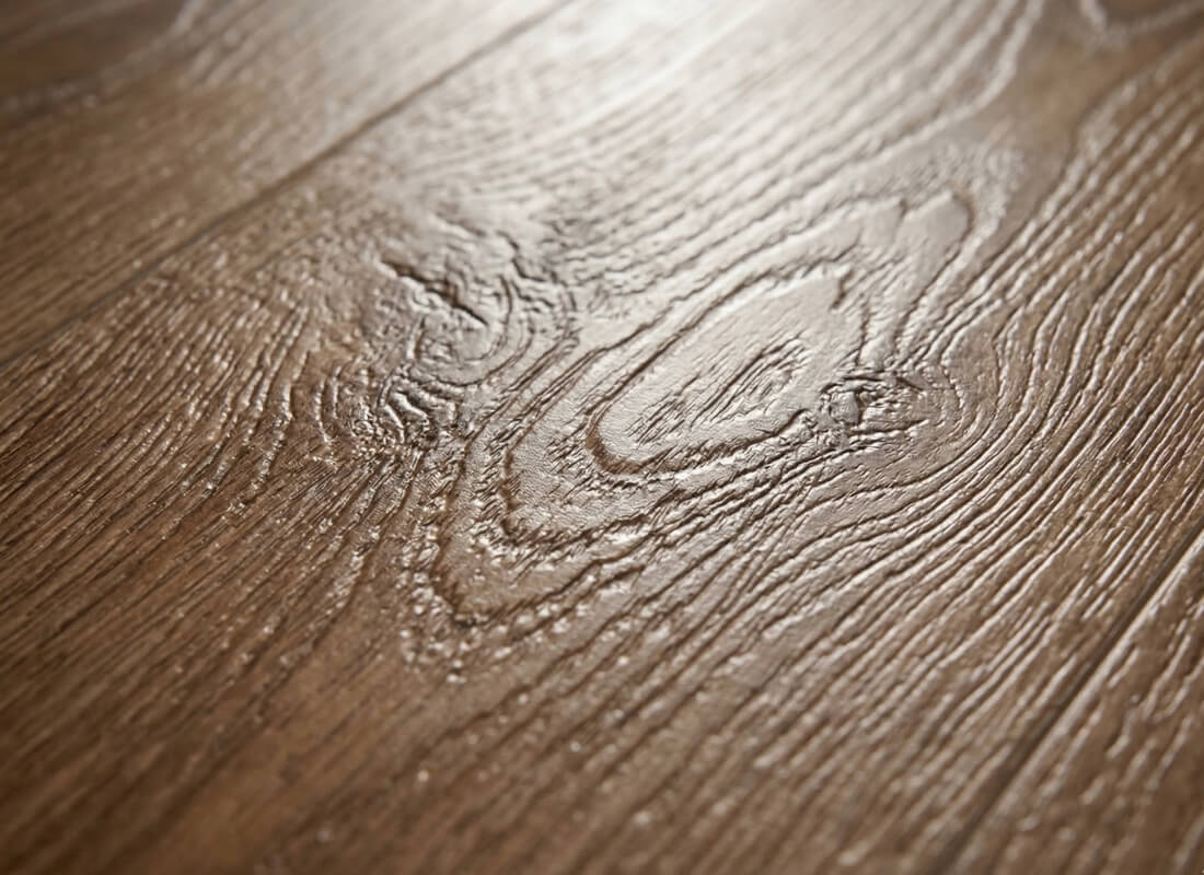 a thick wear layer on luxury vinyl plank, showcasing durable hallway floors for multi-unit buildings